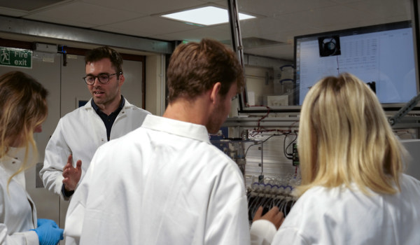 Professor Harrison Steel in his lab, working with students on their research.